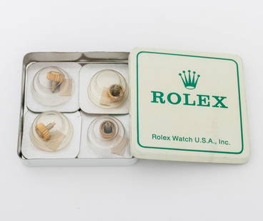Rolex Submariner Triplock 24-703-8 Crowns, 4 Pcs.: Collection of Four Rolex Genuine Submariner Triplock 24-703-8 Yellow Gold Crowns, each in original unopened Rolex packaging. Cannot test for gold. Approx: 7mm Diameter. Provenance: From a Manhattan