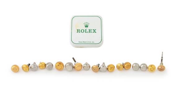 Rolex Bubble Back Stainless Steel Crowns, 18 Pcs.: Collection of 18 Rolex Genuine Bubble Back Stainless Steel Crowns, including: (11) eleven gold-tone and (7) seven silver-tone, with Rolex tin box. Largest: 7mm Diameter. Provenance: From a Manhattan