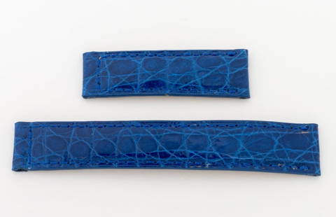 Cartier Blue Crocodile Watch Strap: Cartier Crocodile Skin Loose Watch Strap, in blue for a deployment buckle, marked "Cartier". Longest part: 14mm x 85mm. Provenance: From a Manhattan Collection. Keywords: Watch parts, Time adjuster,