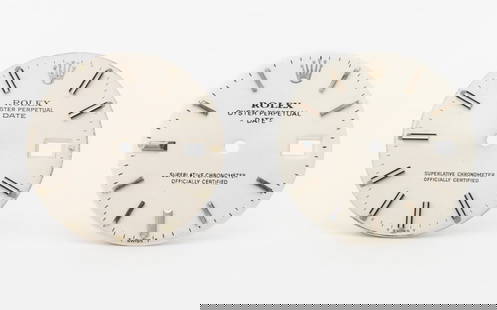 Rolex Oyster Perpetual Date Slow Set Dials, 2 Pcs.: Two Rolex Genuine Oyster Perpetual Date Slow Set Silver Dials, comprising: white color with black and silver-tone baton indices and 3pm date window and white color with silver-tone baton indices and 3