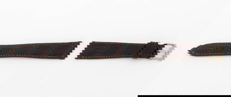 Patek Philippe Brown Crocodile Watch Strap: Patek Philippe Brown Crocodile Skin Loose Watch Strap, with silver-tone buckle, the strap marked "Patek Philippe / Geneve". Longest piece: 18mm x 115mm. Provenance: From a Manhattan Collection. Keywor