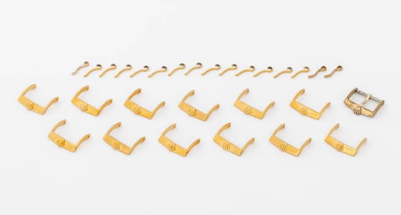 Rolex USA Gold-Tone Loose Watch Buckles, 13 Pcs.: Collection of 13 Rolex USA Gold-Tone Loose Watch Strap Buckles, accompanied with 15 loose prongs, the buckles marked "Rolex". Each: 18mm. Provenance: From a Manhattan Collection. Keywords: Watch