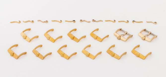 Rolex USA Gold-Tone Loose Watch Buckles, 12 Pcs.: Collection of 12 Rolex USA Gold-Tone Loose Watch Buckles, with 11 loose prongs, each buckle marked "Rolex". Each: 18mm. Provenance: From a Manhattan Collection. Keywords: Watch parts, Time adjuster,