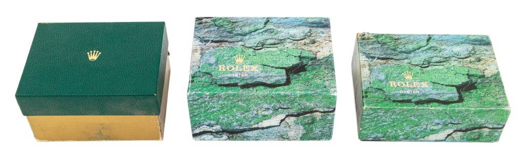 Rolex Green Leather Watch Presentation Boxes, 3: Collection of Three Rolex Genuine Green Leather Watch Presentation Boxes, comprising: one with green velvet inset watch holder for style #R16030A, in original gold and green box, one with wood lined i