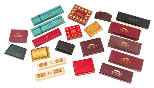 Hamilton, Etc, Watch Presentation Boxes, 20: Collection of 20 Watch Presentation Boxes, including: Hamilton, Longines, Bulova, Baume & Mercier, and Gruen. Largest: 1.75" H x 9" W x 3.25" D. Provenance: From a Manhattan Collection. Keywords: Watc