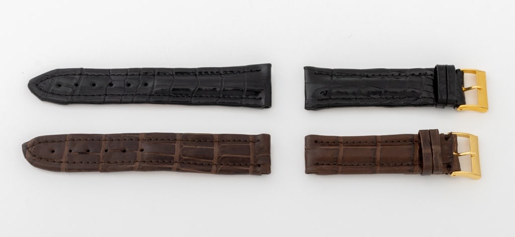 Italian Alligator Loose Watch Straps, 2: Two Italian Alligator Leather Loose Watch Straps, comprising: one brown and one black with gold-tone buckles, each marked "American Alligator Classics Inc. / Genuine Louisiana / Farm Alligator / Handm