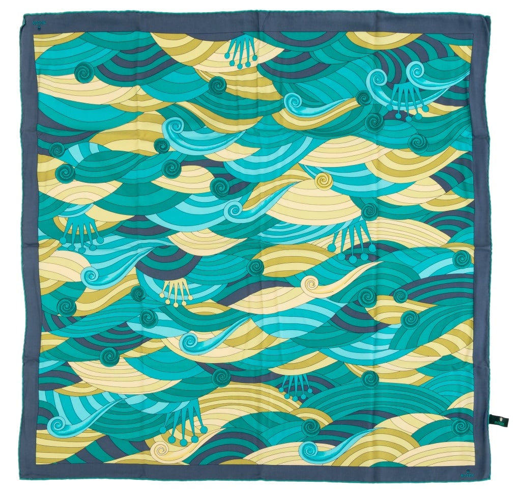 Rolex Silk Scarf: Rolex Silk Scarf, in teal crown and wave pattern with a blue border, "Rolex / 100% Silk / Made in France" label, in original Rolex box. 32.5" L x 33.5" W. Provenance: From a Manhattan Collection. Keyw