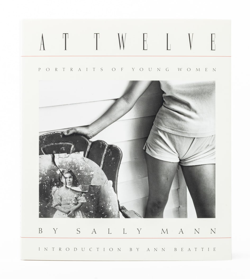 Sally Mann Signed "At Twelve" 2024 Reissue: Mann, Sally, "At Twelve: Portraits of Young Women", New York: Aperture, 2024 reissue, signed by Sally Mann to the title page, with dust jacket. 11.25" L x 9.75" W x 0.5" D. Provenance: From a New York