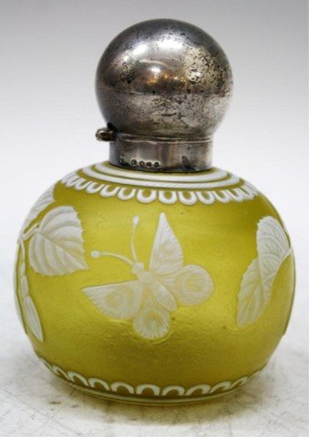English Webb Cameo Glass & Sterling Perfume Bottle: Webb yellow cameo art glass perfume bottle with sterling silver top, England, probably nineteenth century; marked on silver. Dimensions: 4-1/4"H x 3-1/2" diameter