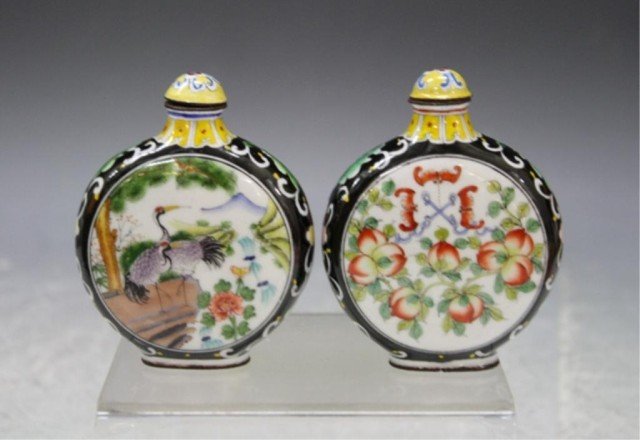 Chinese Lot of 2 Enamel Snuff Bottles: Lot of two snuff bottles with black ground, one with peaches and bats, the other with birds and flowers, enamel, China; marked. Dimensions: each approximately 3-1/8"H x 2-3/8"W x 3/4"D
