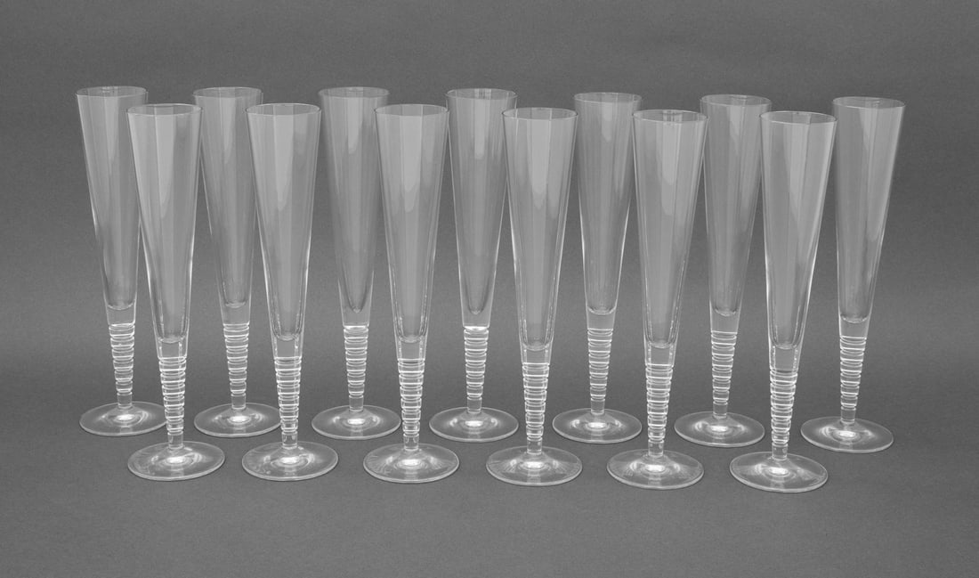 Steuben "Evening" Crystal Champagne Flutes, 13: Set of Thirteen Steuben "Evening" Crystal Champagne Flutes, by Dante Marioni, of tapering form, each signed to underside. 10.25" H x 2.75" Diameter. Provenance: From a Long Island Estate. Keywords: De