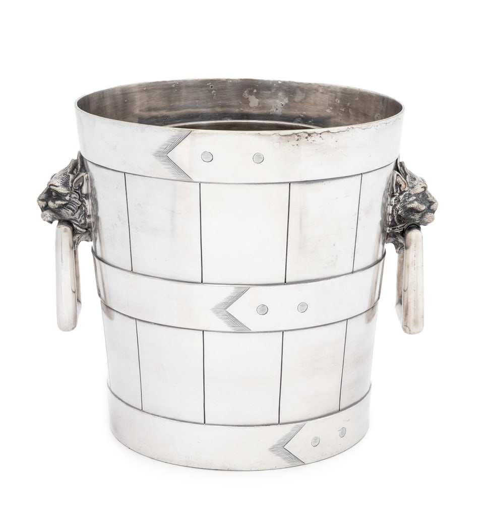 Tiffany & Co. Makers Silver Plate Champagne Bucket: Tiffany and Company Makers Silver Plate Champagne Bucket, with lion head ring handles, marked "Tiffany Makers / S / Silver Soldered / 34 / B" with scratch marks to the underside. 7.5" H x 9.75" Diamet