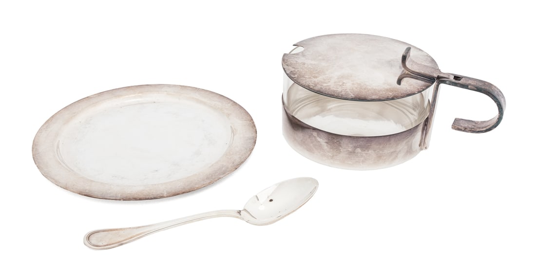 Christofle Silver Plate and Glass Parmesan Pot: Christofle Silver Plate and Glass Parmesan Pot, from the Gallia collection, with underplate and spoon, marked to the underside. Overall: 2.75" H x 7" W x 6.25" D. Provenance: From a New York City Coll