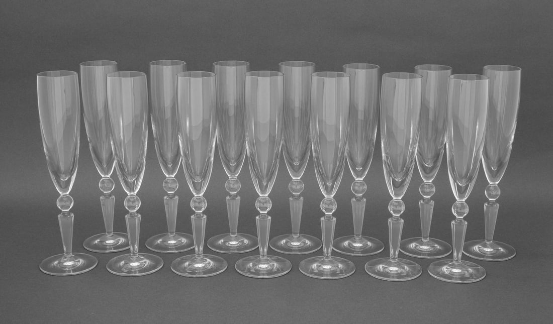 Steuben Counterpoint Crystal Champagne Flutes, 14: Set of Fourteen Steuben "Counterpoint" Crystal Champagne Flutes, each etch marked "Steuben" to underside. 10.25" H x 3" Diameter. Provenance: From a Long Island Estate. Keywords: American designer, Gl