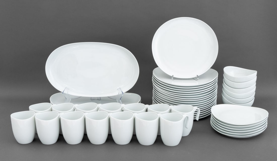 Nambe Ceramic Tableware Set, 47 Pcs.: Nambe Ceramic Tableware Set, all marked and comprising: fourteen (14) coffee mugs, six (6) bowls, six (6) bread plates, eighteen (18) dinner plates, and three (3) oval trays, all marked "nambe / micro