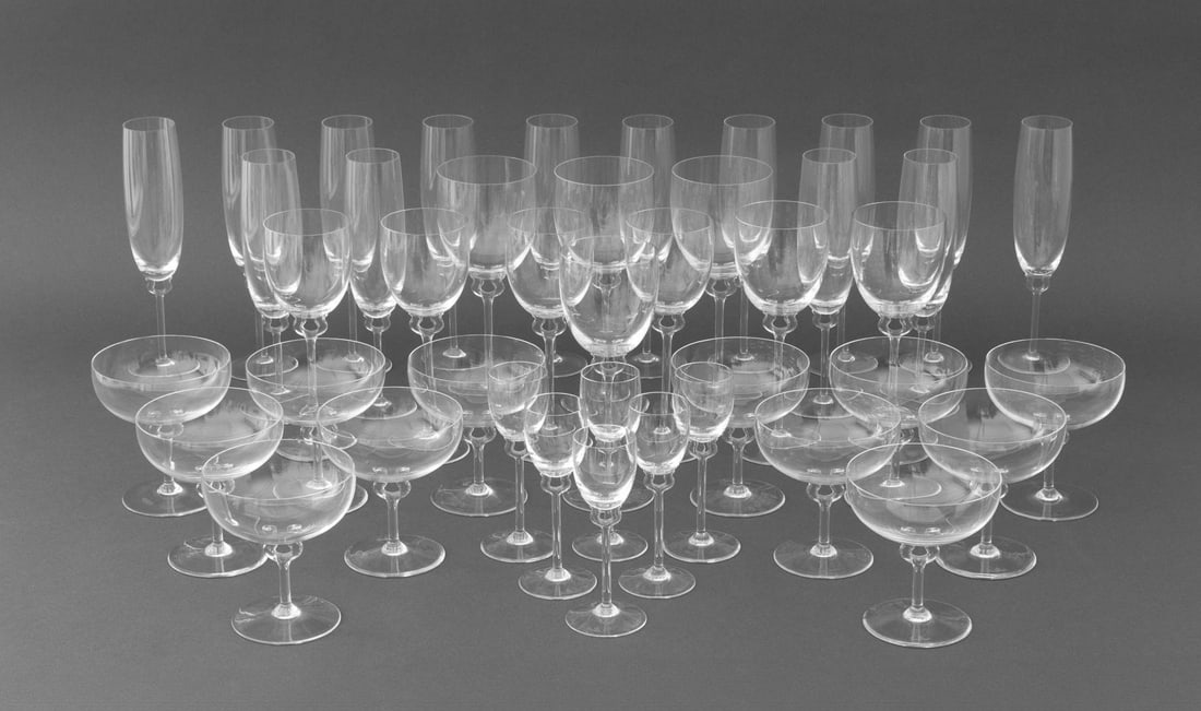 Rosenthal "Asymmetria" Crystal Stemware, 42 Pcs.: Rosenthal "Asymmetria" Crystal Stemware Set, comprising: (14) fluted champagne, (3) water goblets, (3) three red wine, (4) four white wine, (6) port wine, and (12) champagne / sherbert, each marked "R