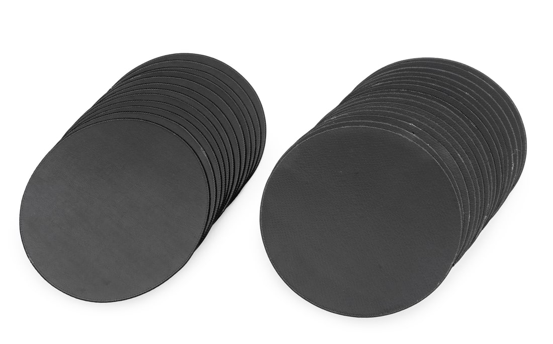 Sybaritic Postmodern Leather Placemats, 28: Set of Twenty Eight Sybaritic Industries Postmodern Leather Placemats, labeled "Sybaritic / Industries Ltd." to reverse, twelve (12) snakeskin print and sixteen (16) crocodile print. 16" Diameter. Pro