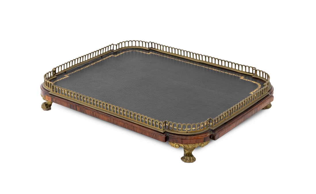 French Tulipwood Pierced Brass Galleried Tray: French Tulipwood Pierced Brass Galleried Tray, with gilt-tooled black leather inset top on four brass paw feet. 2.25" H x 16" W x 12.5" D. Provenance: From an 880 Fifth Avenue Collection. Keywords: Em