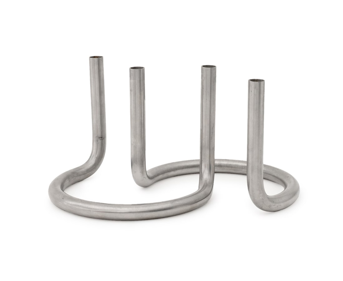 Peter Karpf for Lundtofte Gemini Candle Holders, 2: Pair of Peter Karpf for Lundtofte Gemini Stainless Steel Candlesticks, marked "Design: Peter Karpf / Lundtofte Denmark". 4.75" H x 6.25" W x 5" D. Provenance: From an 880 Fifth Avenue Collection. Keyw