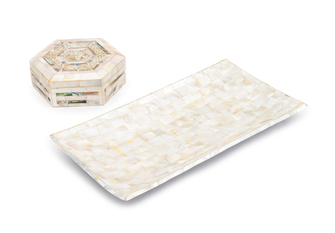 Mother-of-Pearl Desk Accessories, 2: Two Mother-of-Pearl Desk Accessories, comprising: rectangular tray and hexagonal trinket box with pierced and carved floral design and red silk lined interior. Larger: 1" H x 12.25" W x 6.25" D. Prove