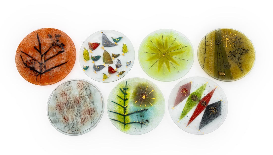 Frances and Michael Higgins Art Glass Plates, 7: Frances and Michael Higgins (American, 1912-2004; 1908-1999) Group of Seven Art Glass Plates, each with unique design, signed to undersides. 8.5" Diameter x 1" H. Provenance: From the Collection of La