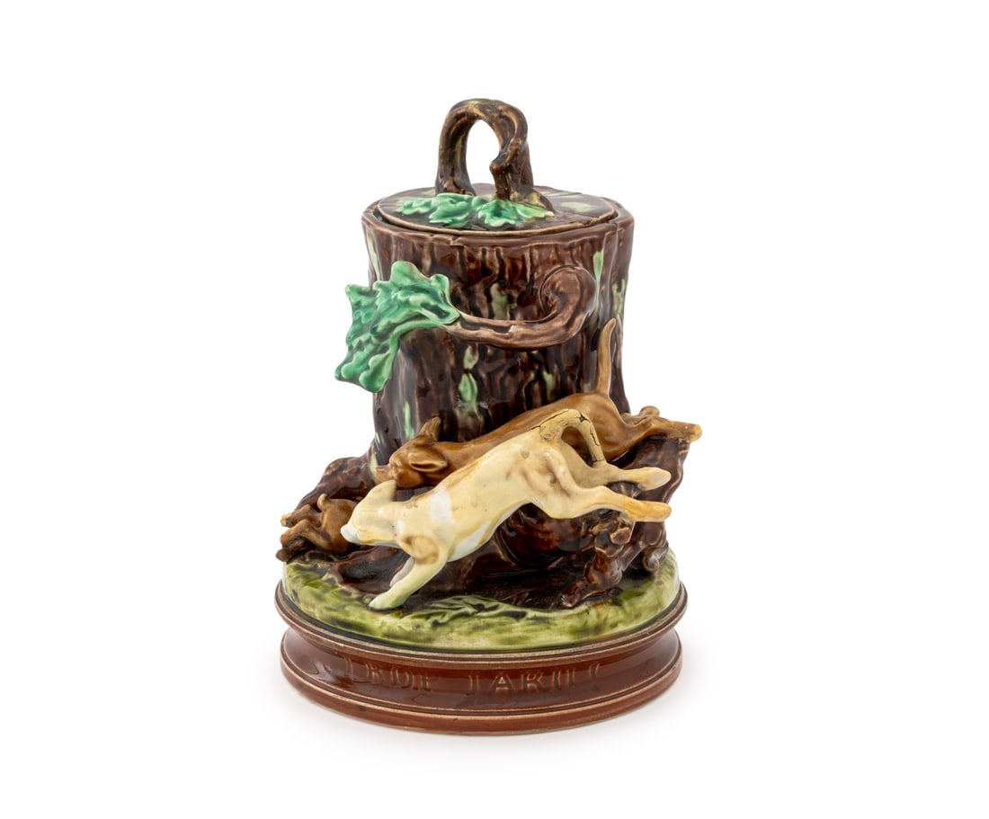 Majolica Sarreguemines "Trop Tard" Covered Jar: Majolica Sarreguemines "Trop Tard" [Too Late] Covered Jar, in the form of hunting dogs diving into a tree trunk, titled to base, with impressed "Majolica / Sarreguemines / 482 / I" marks and ink "11"