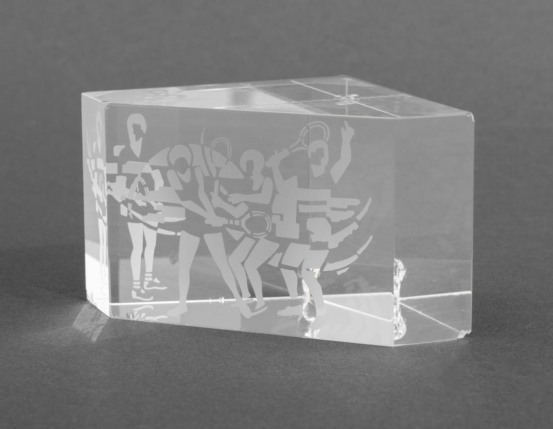 Steuben "Tennis Players" Etched Glass Paperweight: Steuben "Tennis Players" Etched Glass Paperweight, designed by Bernard X. Wolff, signed "Steuben B.X.W." to the underside. 2.25" H x 4.25" W x 2.75" D. Provenance: From an 880 Fifth Avenue Collection.