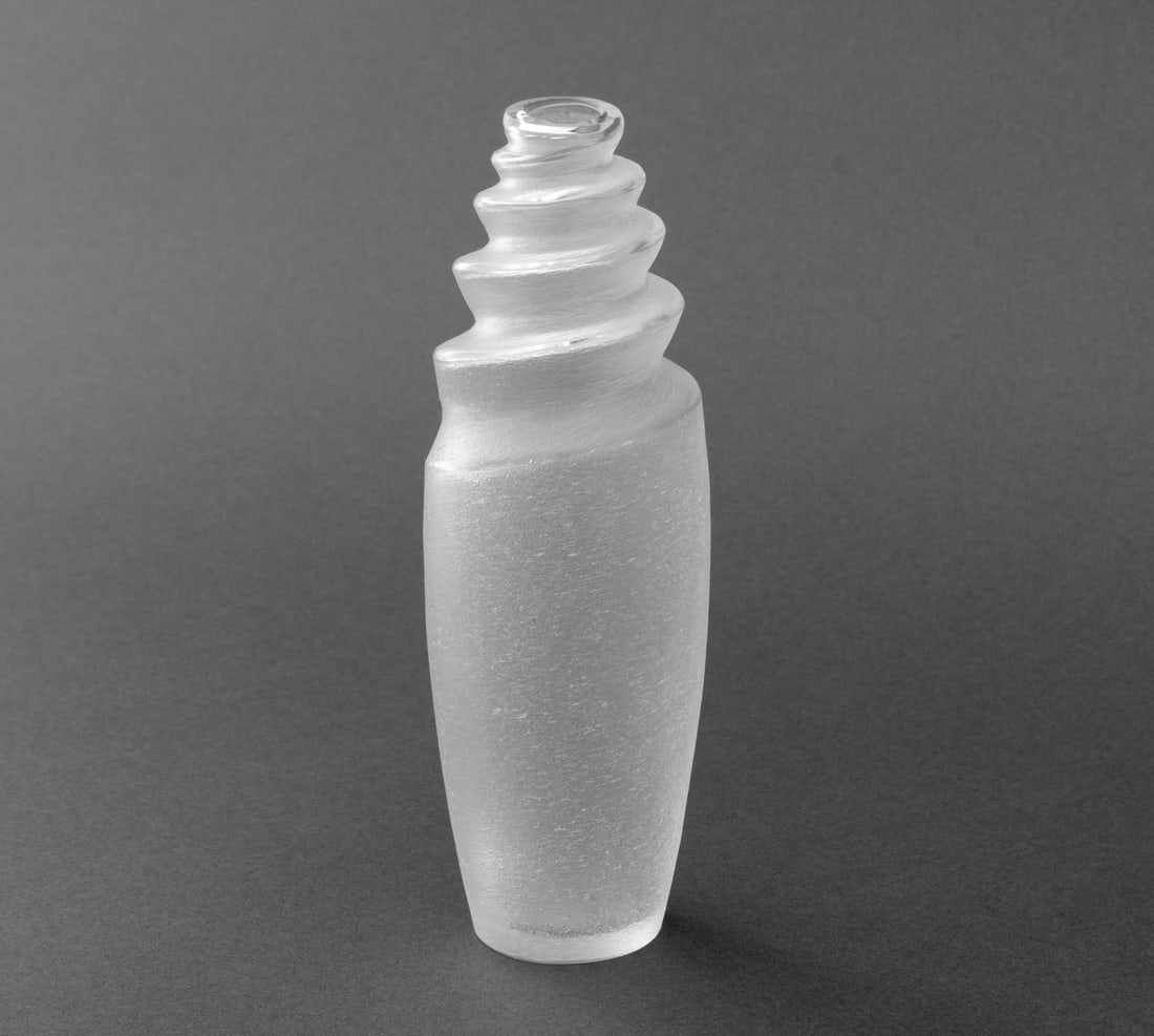 Lalique Frosted Crystal Bud Vase: Lalique Frosted Crystal Bud Vase, with spiral design and marked "Lalique France" to underside. 7.25" H x 2.5" Diameter. Provenance: From a Long Island Estate. Keywords: Designer, French crystal, Art G