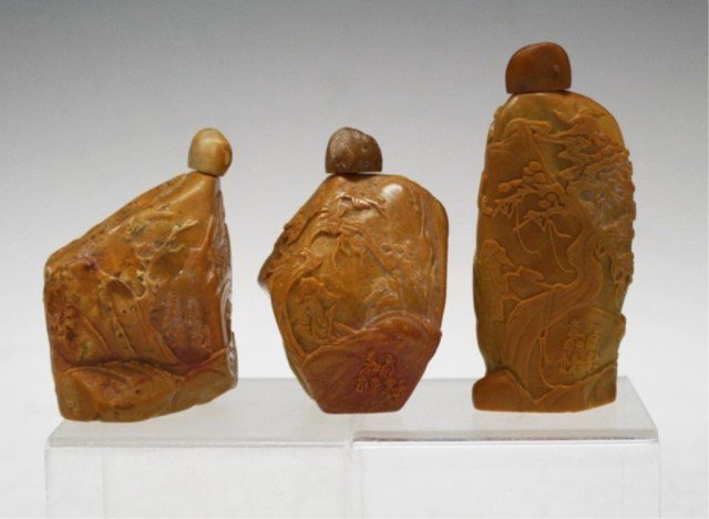 Lot of 3 Soapstone Snuff Bottles: Three carved soapstone snuff bottles, China; marked. Dimensions: 1) 3-3/4"H x 1-3/4"L x 3/4"W; 2) 3"H x 2"L x 1-1/2"W; 3) 3"H x 2"L x 1-1/2"W
