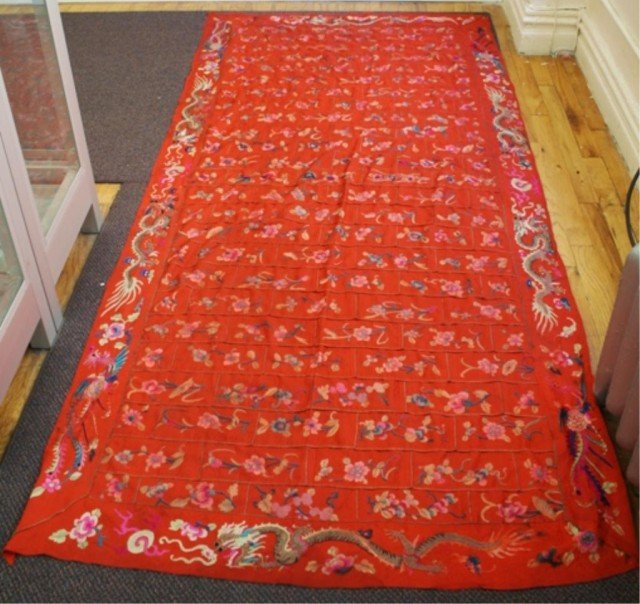 Mongolian Silk Lama's Robe 19th-20th Century: A red silk lama's robe with dragon and floral design, Nineteenth or Twentieth Century, Mongolia; unmarked. Dimensions: 90" H x 42" W