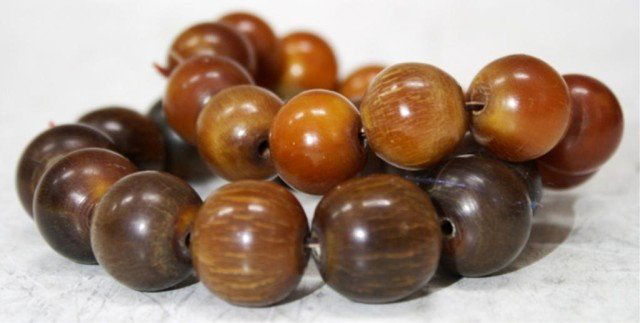 Pair of Chinese Horn Beaded Bracelets: A pair of horn beaded bracelets, China; unmarked. Dimensions: 3-1/2" Outer diameter , 2" Inner diameter, Beads 3/4" diameter