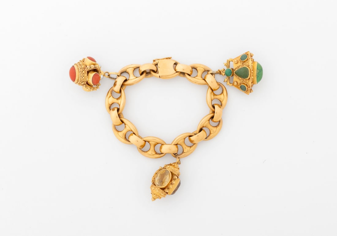 18K Yellow Gold Chalcedony Topaz Charm Bracelet: 18K Yellow Gold Chalcedony and Topaz Charm Bracelet, brightly polished heavy anchor link chain bracelet joined with box and tongue clasp and figure 8 safety clasp, adorned with three charms decorated