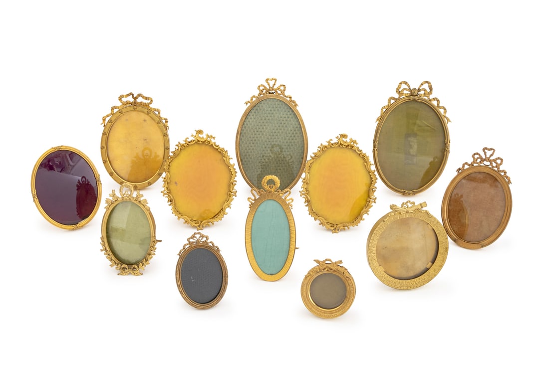 French Empire Gilt Metal Picture Frames, 12: Collection of Twelve French Empire and Second French Empire Gilt Metal Picture Frames, 19th century, four by Jules Hautecoeur, and one marked "E / France" to reverse. Tallest: 6.5" H x 4.75" W x 6.75"