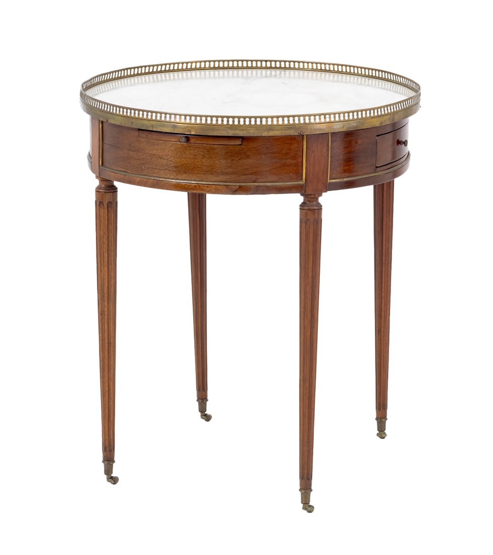 Louis XVI Marble and Mahogany Bouillotte Table: Louis XVI White Marble and Mahogany Bouillotte Table, with pierced brass galleried top and two short drawers on four fluted tapered legs on brass casters. 30" H x 25.5" Diameter. Provenance: Property