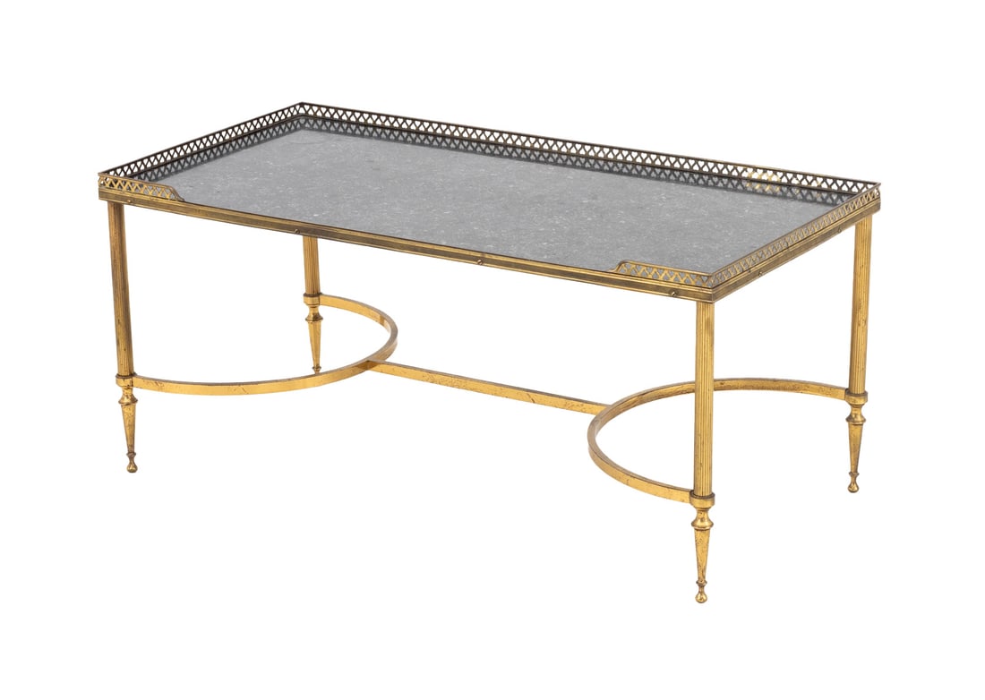 Maison Jansen Marble and Brass Coffee Table: Maison Jansen Black Fossil Marble and Brass Coffee Table, with heart shaped pierced three-quarter galleried top on four tapered legs conjoined by two half circle stretchers. 16.5" H x 35.5" W x 18" D.
