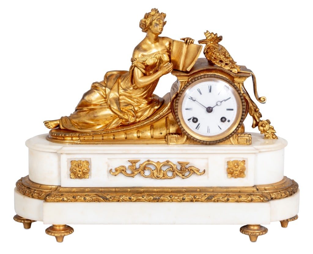 Louis XV Style Gilt Bronze and Marble Mantel Clock: Louis XV Style Gilt Bronze and White Marble Figural Mantel Clock, mid 19th century, the white enamel dial, with strike on bell movement, surmounted by a reclining lady holding a book, and a wreath, on