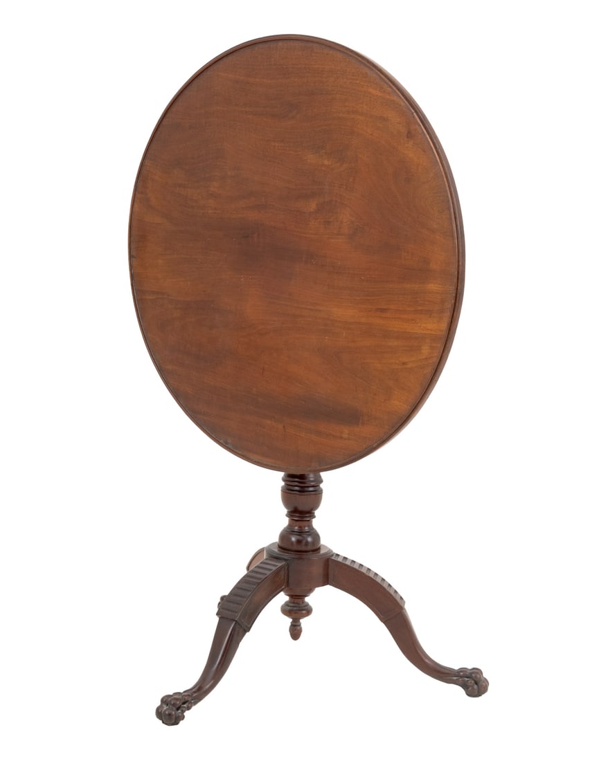 George III Style Mahogany Tripod Table: George III Style Mahogany Tripod Table, the circular top above a birdcage base terminating in three paw feet. 28.25" H x 28.75" Diameter. Provenance: Property from a Bunny Williams decorated 5th Avenu