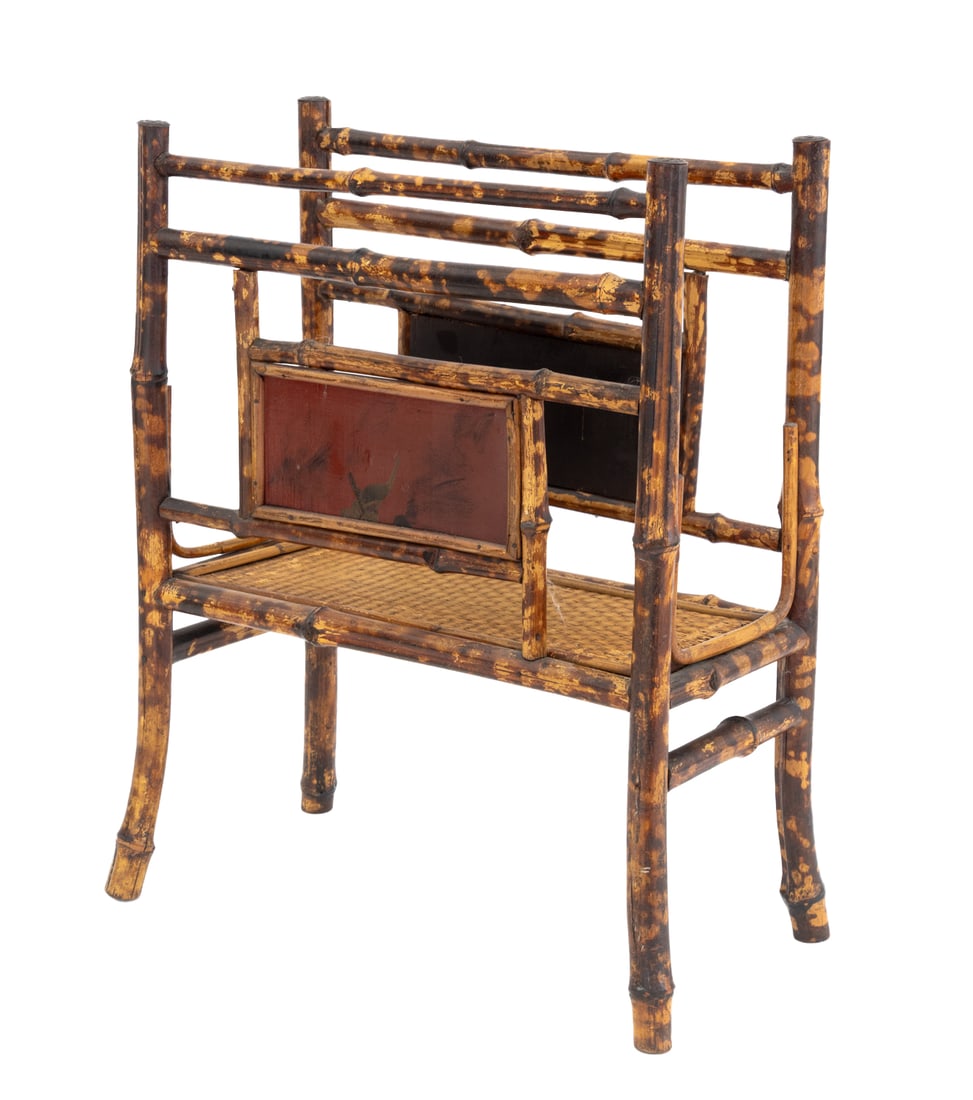 Victorian Tortoiseshell Finish Bamboo Canterbury: Victorian Tortoiseshell Finish Bamboo Canterbury, with red lacquered panels, floral rosette brass caps, and woven wicker base. 20.25" H x 17" W x 9.25" D. Provenance: Property from a Bunny Williams de