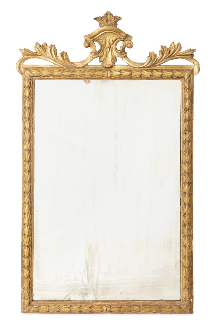 Louis XVI Style Giltwood Mirror, 19th C.: Louis XVI Style Giltwood Mirror, 19th century, with shield and scroll form crest with carved floral border. Mirror plate: 30" H x 20" W; frame: 41" H x 25.5" W x 2" D. Provenance: Property from the