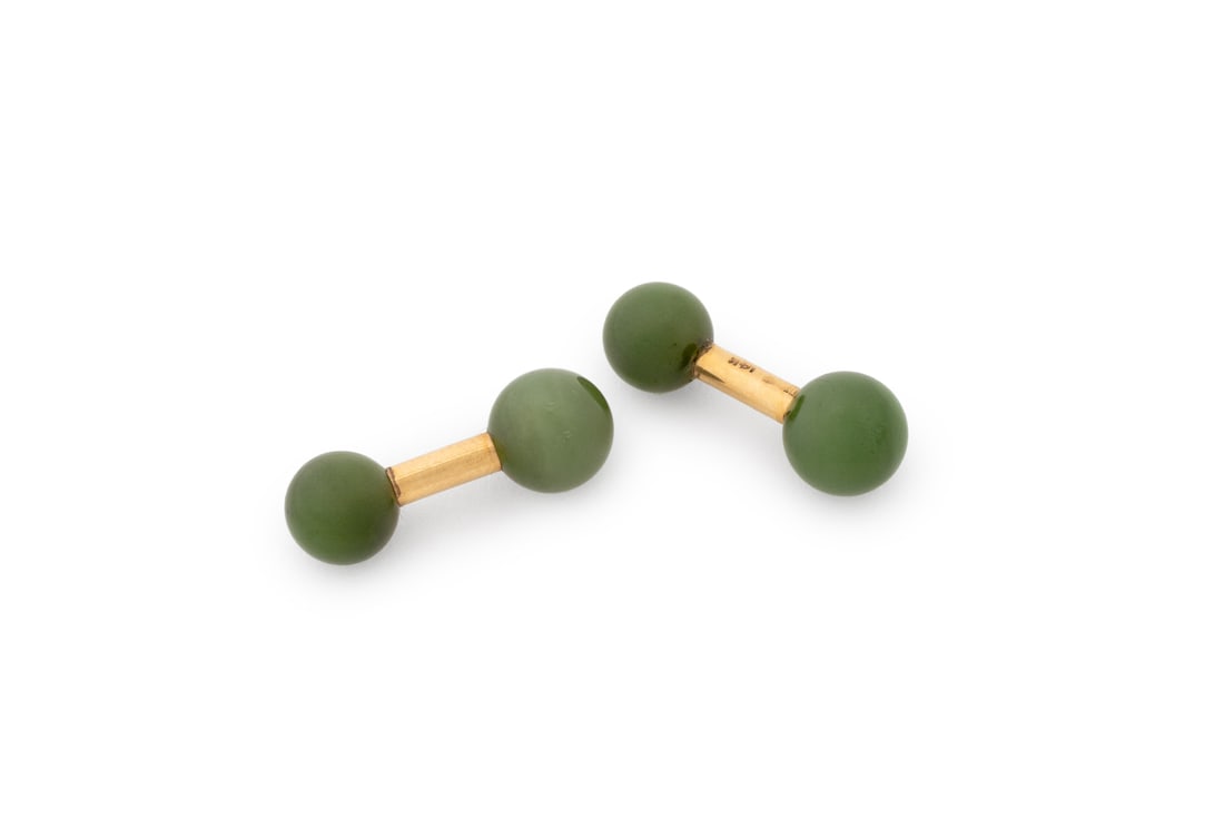 Tiffany & Co. 14K Yellow Gold Jade Cufflinks: Pair of Tiffany and Company 14K Yellow Gold Jade Cufflinks, adorned with four round jade beads approx. 9.0 - 10.0 mm., worn through French cuffs with fixed posts and terminal beads, marked: "TIFFANY 1