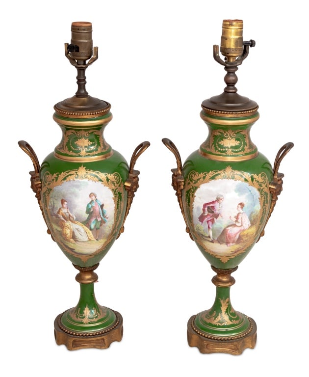 Sevres Green Ground Vases Mounted as Lamps, Pair: Pair of Sevres Gilt Metal Mounted Green Ground Porcelain Two Handle Vases Mounted as Lamps, early 20th century, each painted with romantic panels of courting couples and landscapes, signed "A Gilbert"