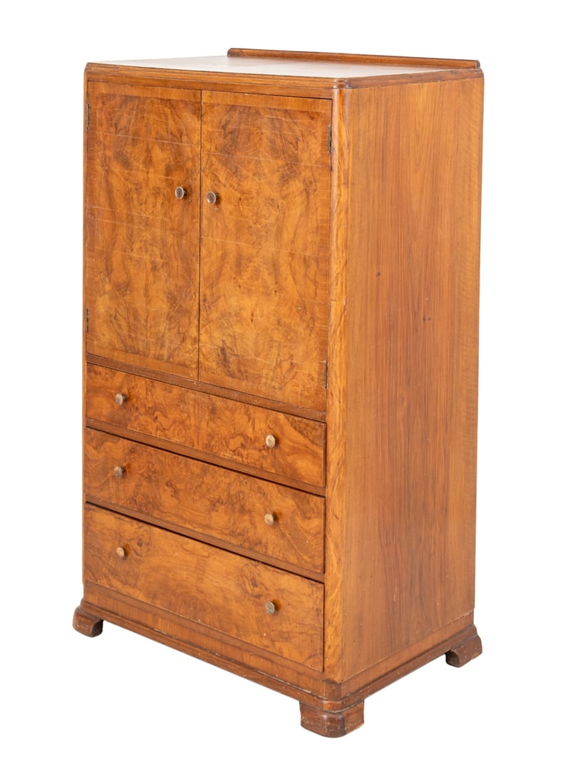 Art Deco Walnut Linen Press, 1930s: Art Deco Walnut Linen Press, late 1930s, with two doors opening to three shelves above three graduated frieze drawers. 51.5" H x 29.5" W x 19" D. Provenance: From an East 80th Street, New York City Es