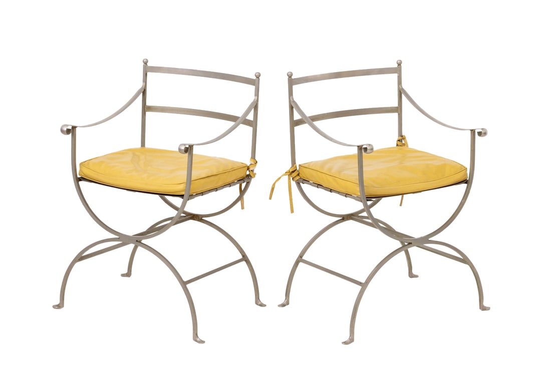 Maison Jansen Style Steel Curule Armchairs, Pair: Pair of Maison Jansen Style Steel Curule Arm Chairs, with yellow vinyl cushions and domed steel base conjoined by three stretchers. 33" H x 20.5" W x 17.5" D; seat: 21" H. Provenance: From an Amawalk,
