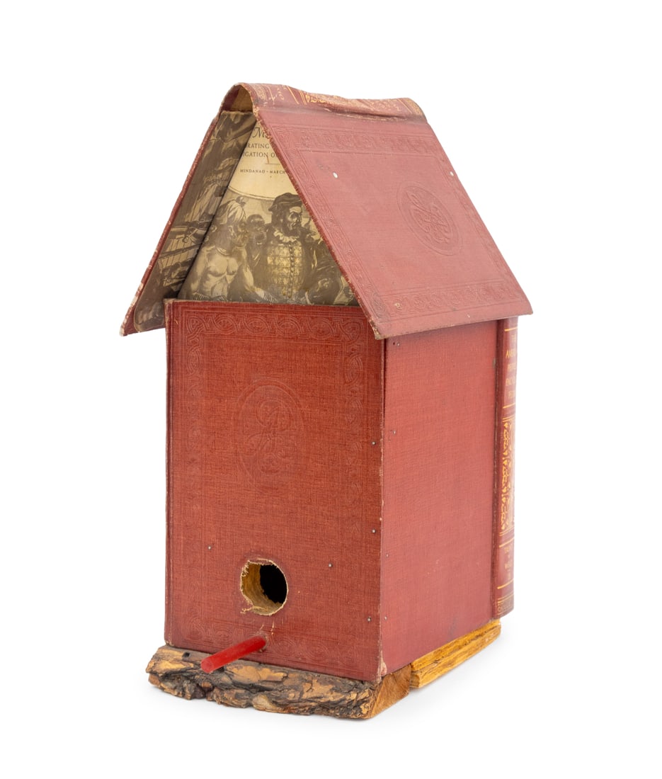 Folk Art Decoupage Leather-Bound Book Bird House: Folk Art Decoupage Leather-Bound Book Bird House, comprising of "The American Peoples Encylopedia" with live edge wood base. 17" H x 7.5" W x 11.5" D. Provenance: From the Collection of Laura and Lewi