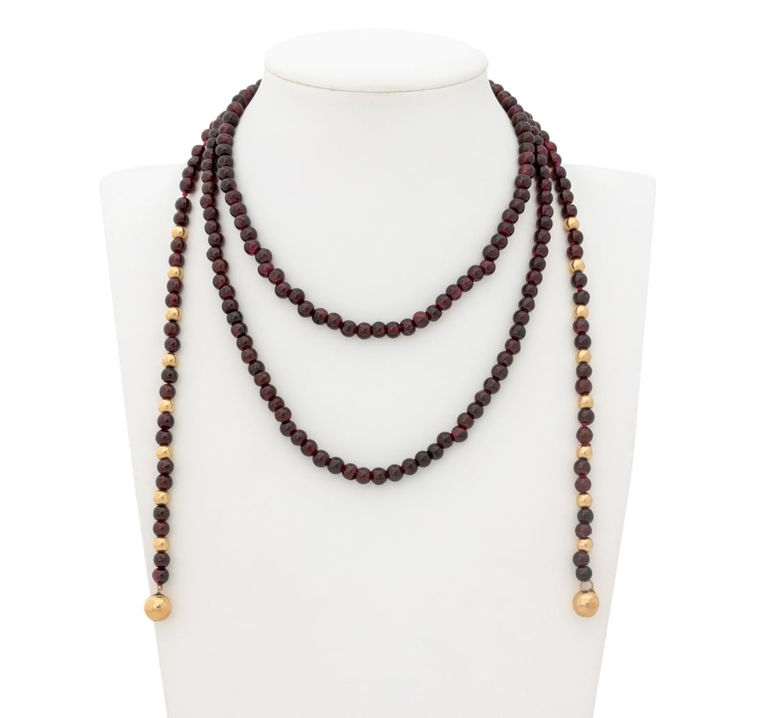 14K Yellow Gold Garnet Bead Lariat Necklace: 14K Yellow Gold Garnet Bead Lariat Necklace, featuring fully drilled round garnet beads approx. 4.5 - 5.0 mm, with 14k yellow gold rondelles approx. 4.5 - 8.0 mm, strung on silk cord with intermittent