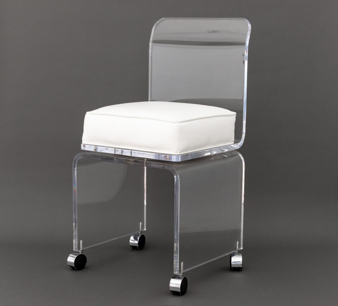 Modern Lucite Swivel Vanity Chair: Modern Lucite Swivel Vanity Chair, with white leather cushion on waterfall base and four casters. 32" H x 16" W x 17" D; seat: 20.5" H. Provenance: From a Long Island Estate. Keywords: Modern