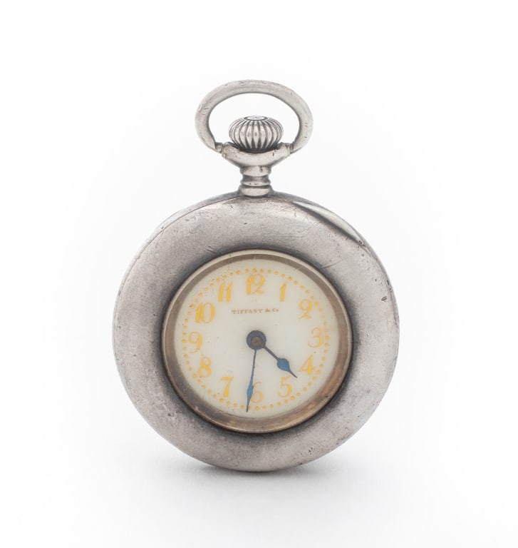 Tiffany & Co. 935 Silver Swiss Pocket Watch: Tiffany and Company Sterling Silver Swiss Pocket Watch, featuring white dial with golden Arabic numeral indexes, powered by mechanical wind-up movement, marked: "Tiffany & Co." (dial, case, and