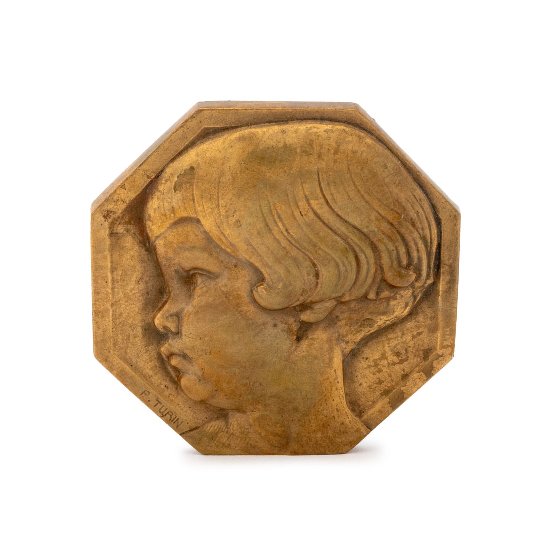 Pierre Turin "Tete d'Enfant" Gilt Bronze Medallion: Pierre Turin (French, 1891-1968) "Tete d'Enfant" Gilt Bronze Medallion, with head of a young girl to obverse and signed "P. Turin", and a collection of toys reverse. 2.25" L x 2.25" W. Provenance: Fro