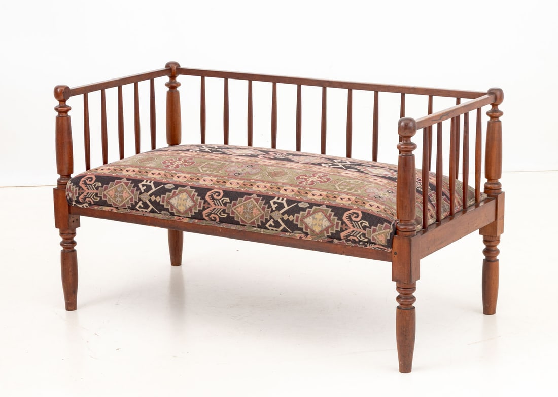 Arts & Crafts Style Upholstered Walnut Settee: Arts and Crafts Style Upholstered Walnut Settee, with spindle back and turned wood supports. 26.25" H x 45" W x 23" D; seat: 15.5" H. Provenance: From a New York City Collection. Keywords: Vintage