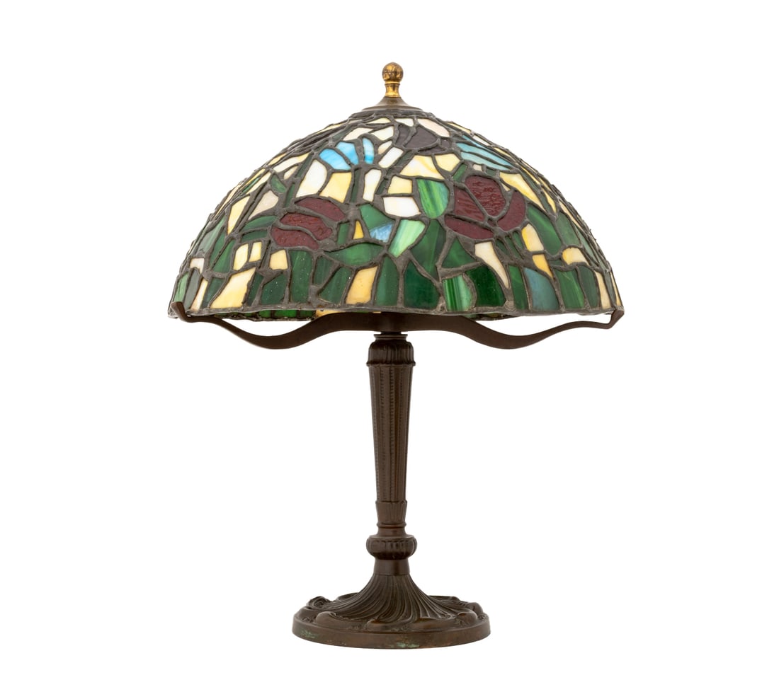 Tiffany Studios Style Stained Glass Table Lamp: Tiffany Studios Style Stained Glass Table Lamp, bronzed patinated metal base with three bulb fittings below a tulip flower motif polychrome slag glass shade, unmarked. 21" H x 16.5" Diameter. Provenan